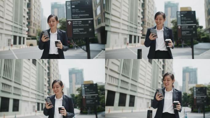 亚洲女商人在城市使用手机