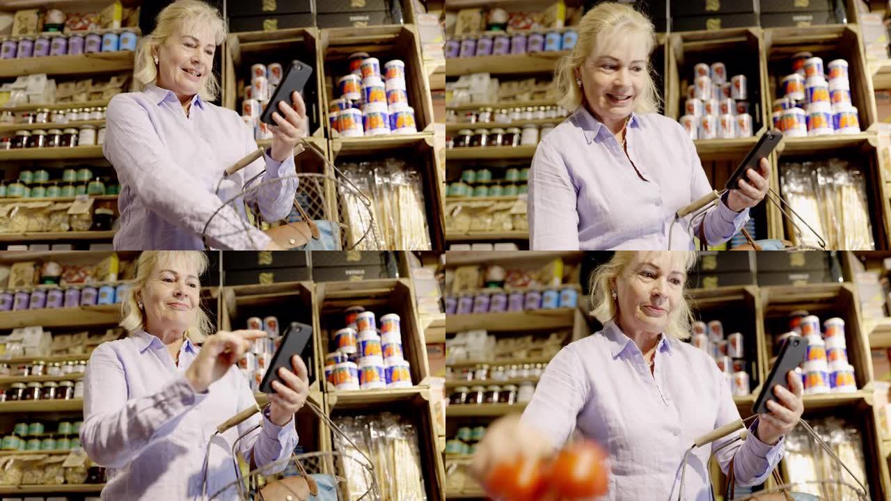 在熟食店购物时使用智能手机的女人