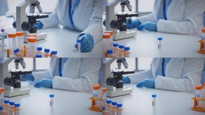使用显微镜保存标记为o型的血液样本进行研究的实验室工作人员的特写