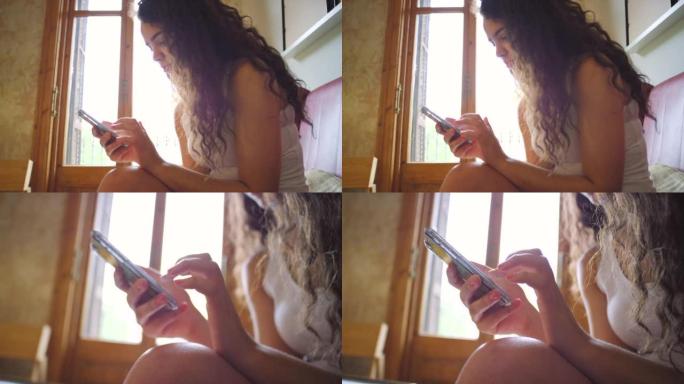 一名年轻女子使用智能手机的4k视频片段