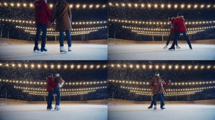 浪漫的冬天下雪的夜晚: 滑冰夫妇在溜冰场上玩得开心。双人花样滑冰。男生见女朋友，开始跳舞。恋爱中的温