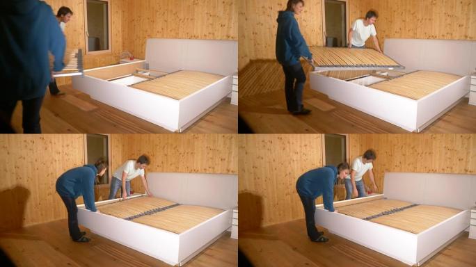 特写: 年轻夫妇一起工作，在他们的新家组装一张大床。