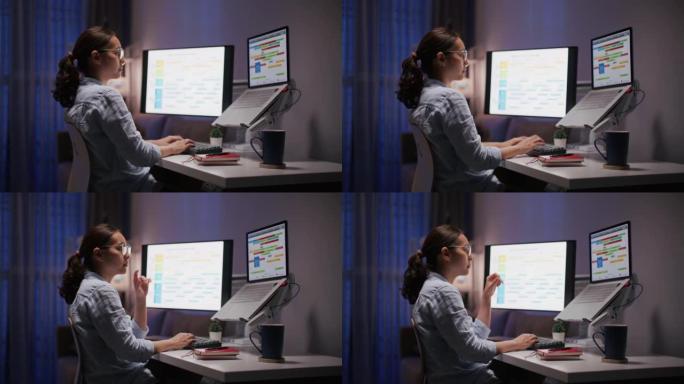 晚上在计算机上工作的亚洲妇女