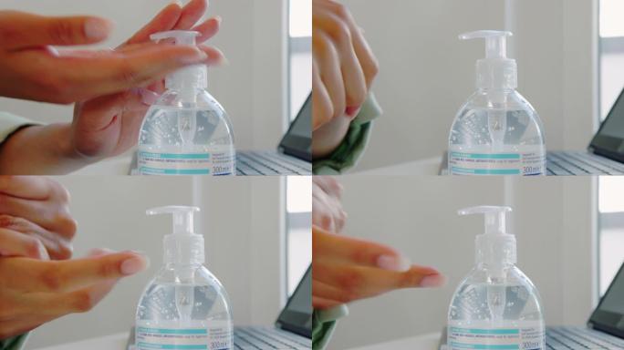 使用洗手液的女性手
