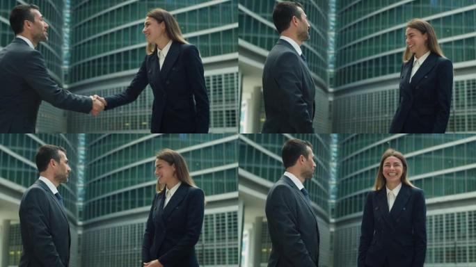 在正式服装中微笑的商业伙伴的电影镜头在开始在摩天大楼背景上开会之前握手。企业、财务、交易、成功、合作