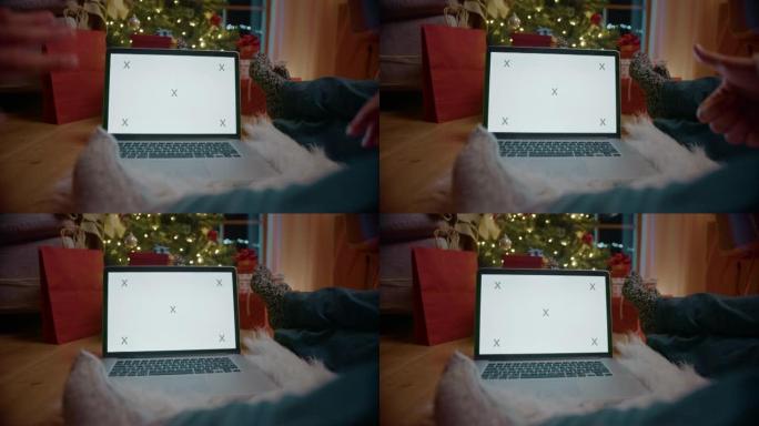 在圣诞节前夕，POV在笔记本电脑上进行视频通话时双手挥舞