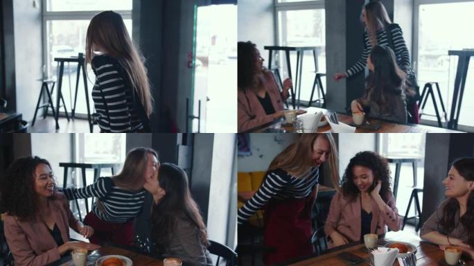 多民族友谊概念。三个年轻快乐迷人的微笑女性朋友兴奋地在时尚咖啡馆见面。