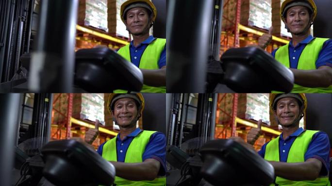 多莉拍摄肖像: 亚洲男叉车操作员微笑。仓储货物行业概念。