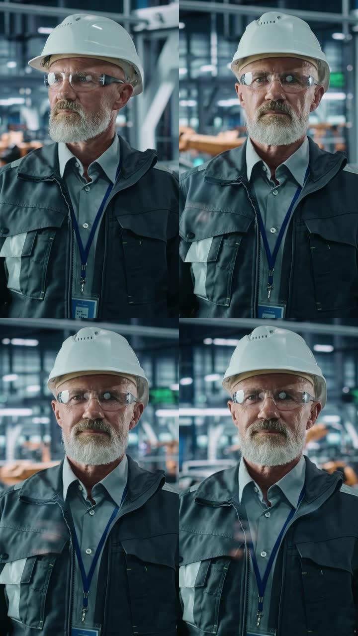 垂直屏幕。汽车厂办公室: 高级白人男总工程师看着相机微笑的肖像。高科技设施自动化机器人手臂装配线制造