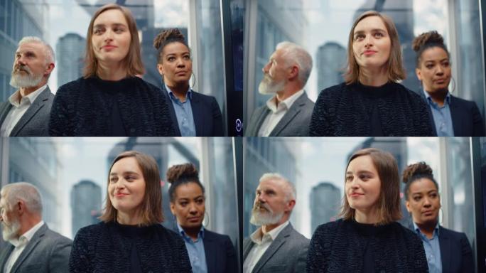 三个不同的多民族国际人士乘坐玻璃电梯在一个现代化的商务中心办公。关注站在电梯里的不同商人。