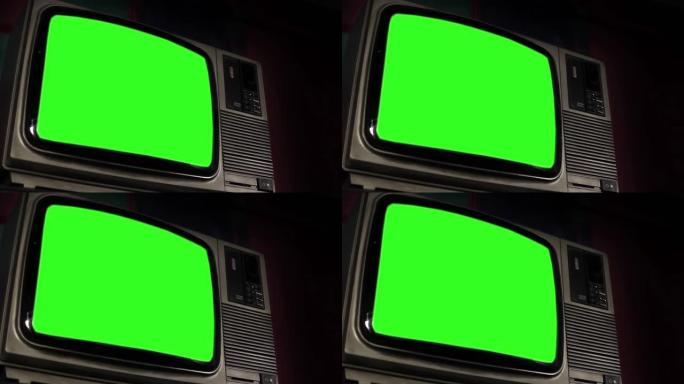 黑色墙壁和色度键绿色屏幕上的旧模拟电视。低角度视图。特写。4K。
