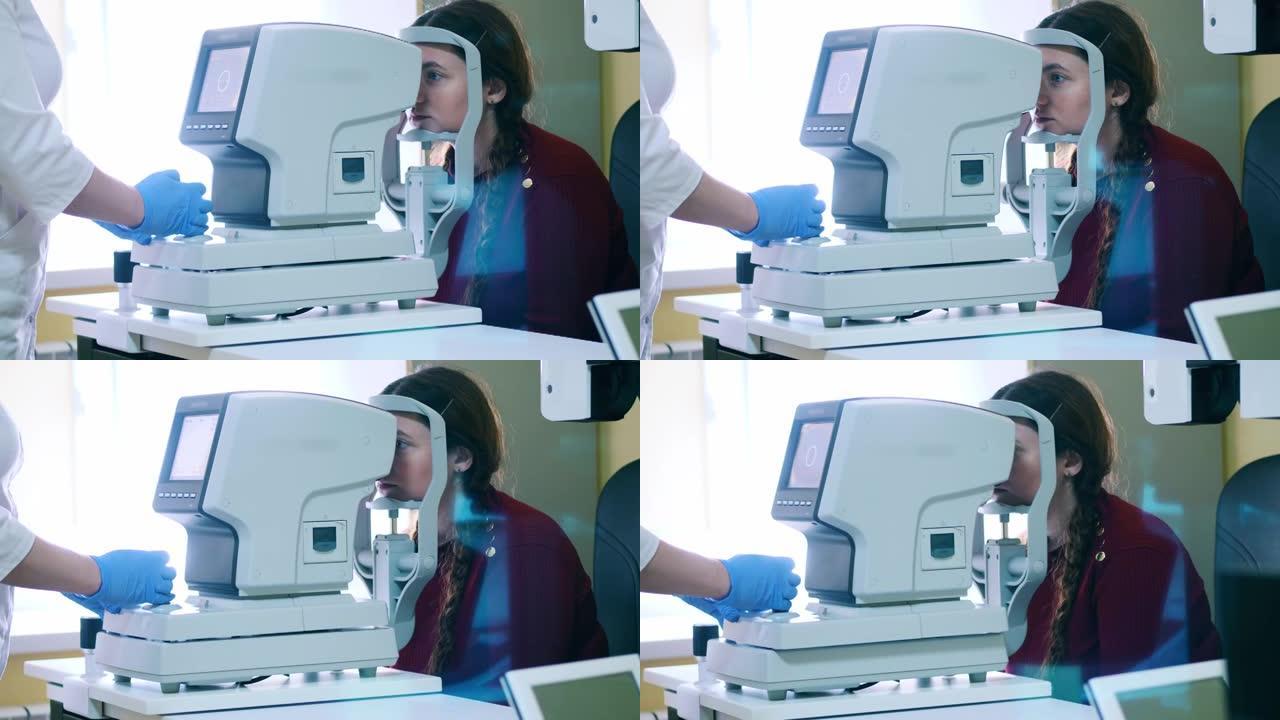 医务人员正在使用机器检查妇女的眼睛