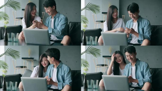 快乐的年轻亚洲夫妇在家网上购物