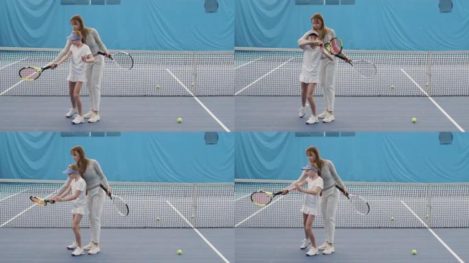 小女孩接受个人网球训练