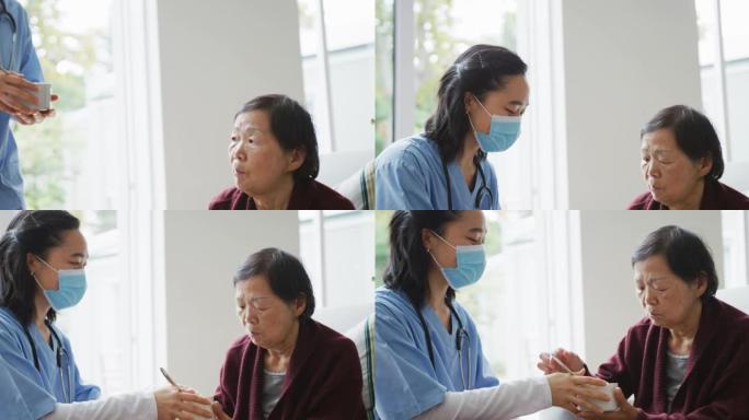 亚洲女护士戴口罩带汤给坐在病床上的资深女病人