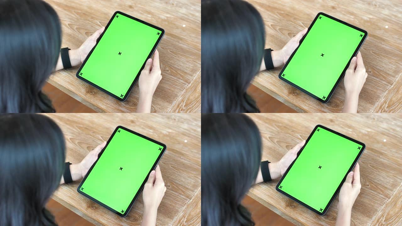 在家中使用色度键屏幕平板电脑的特写女人