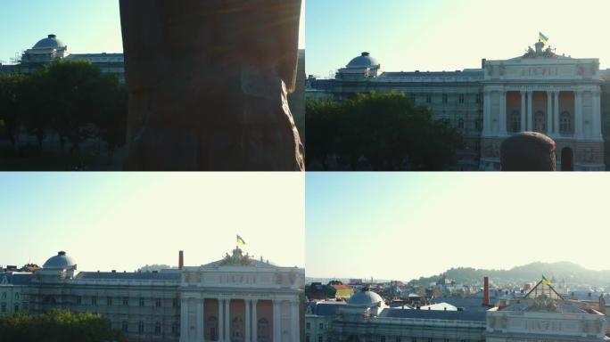 日出时，无人机在历史纪念碑上空升起，行政大楼上展示着乌克兰光荣的国旗。