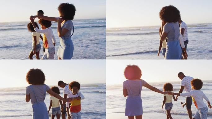 非裔美国母亲和儿子在日落时在海滩上跳舞