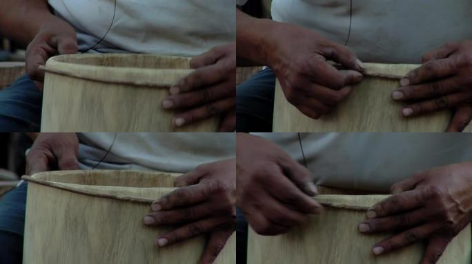 鼓制造商制作 “bomboleg ü ero”，这是一种用木头和动物皮革制成的阿根廷鼓，用于当地传统