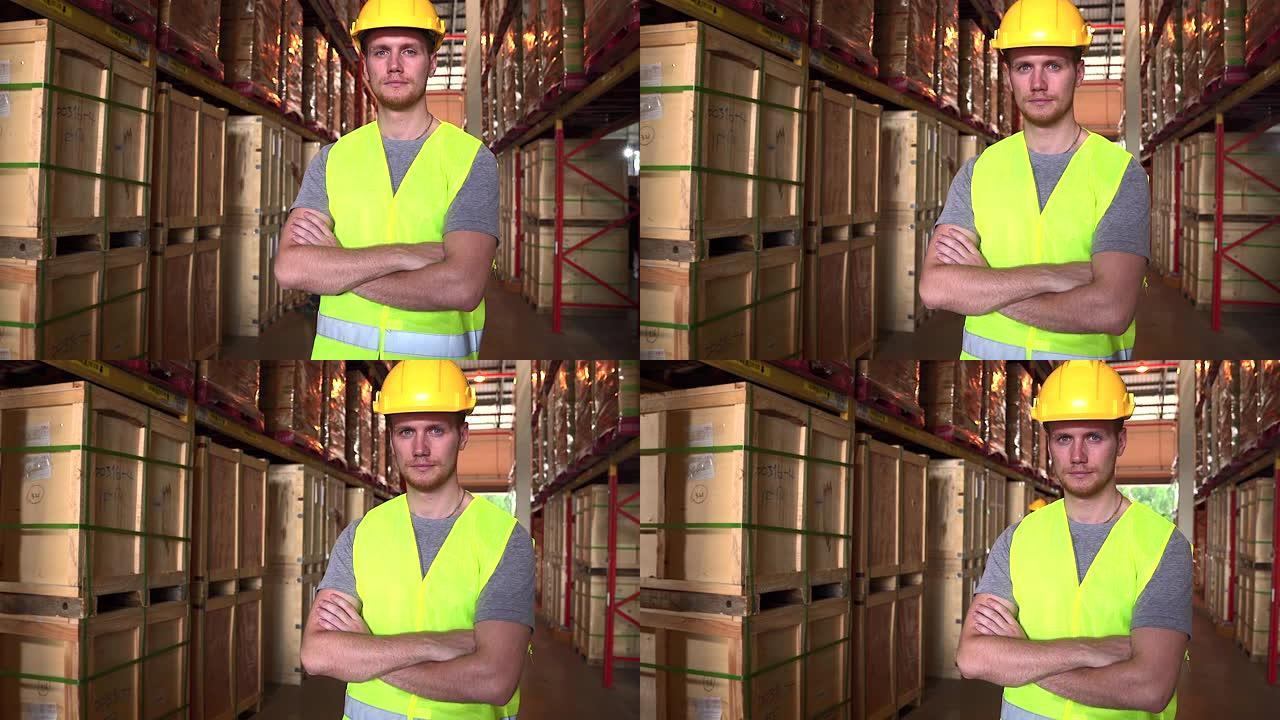白人工人穿着反光衬衫和头盔，站着看着相机，他努力检查仓库中的货物，用于工业用途，陆运和空运货运