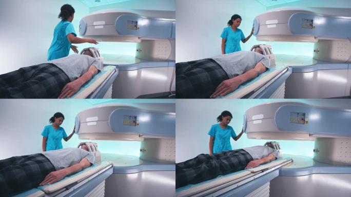 黑人女医生准备高级男性患者进行脑部MRI检查