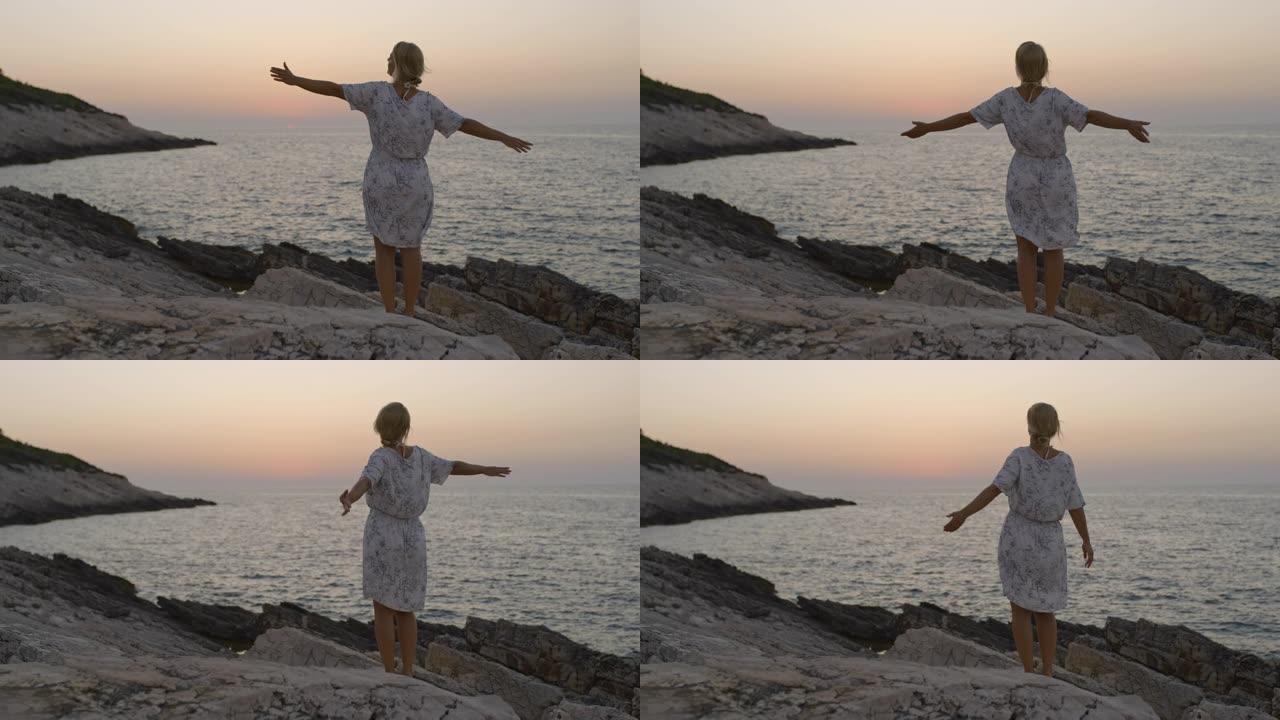 女士无忧无虑的年轻女子享受着风景秀丽的海景，克罗地亚亚得里亚海