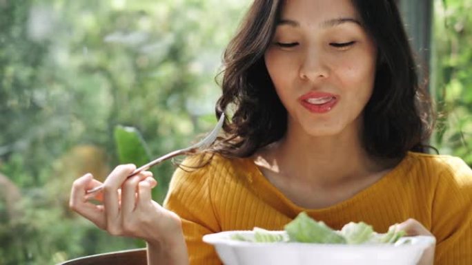 健康饮食吃有机蔬菜亚裔女人