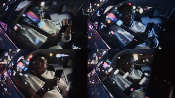 时髦的戴眼镜的黑人在晚上坐出租车的后座上下班。英俊的男性使用智能手机，在城市街道上开着霓虹灯的汽车时