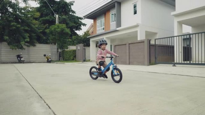 骑自行车的孩子。小男孩骑自行车特写视频素