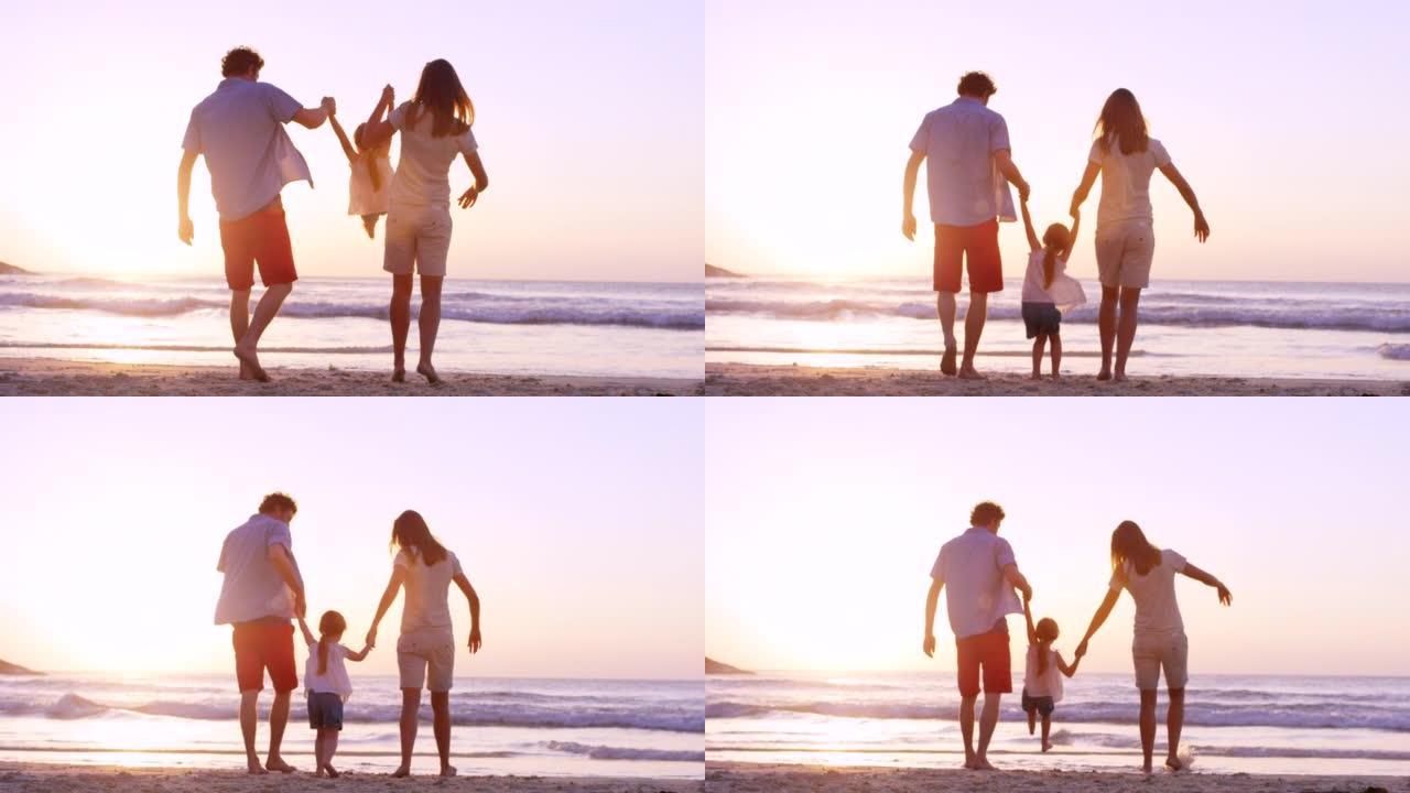 4k视频片段，一位母亲和父亲在海滩上空中挥舞着女儿