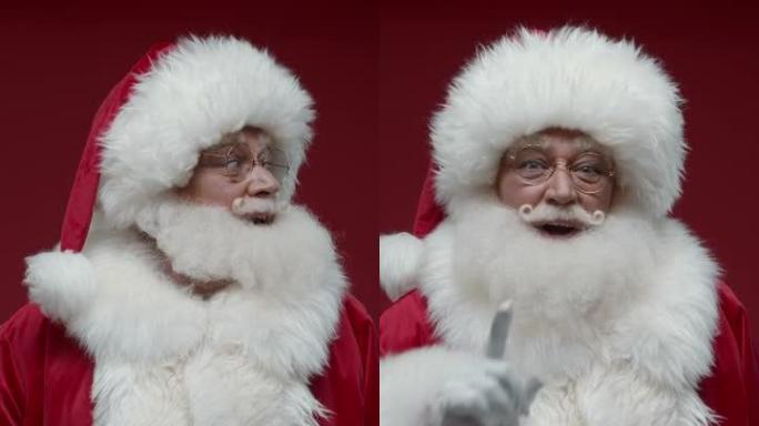 红色背景上的圣诞老人的垂直视频环顾四周，向我们展示了一个沉默的标志，将他的手指笑着放在嘴唇上，