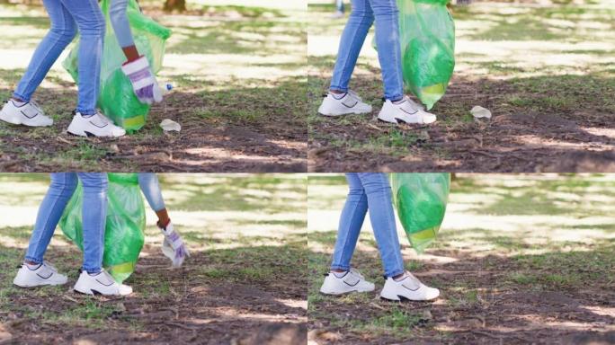 一名社区服务志愿者为环保星球清洁公园的特写镜头。负责任的环保主义者或激进主义者将回收或可重复使用的材