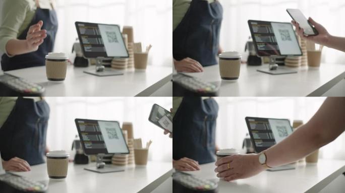 客户通过智能手机进行非接触式支付，在咖啡店进行二维码支付