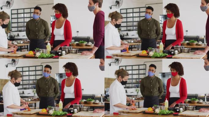 高加索女厨师教授戴口罩的多元化团体
