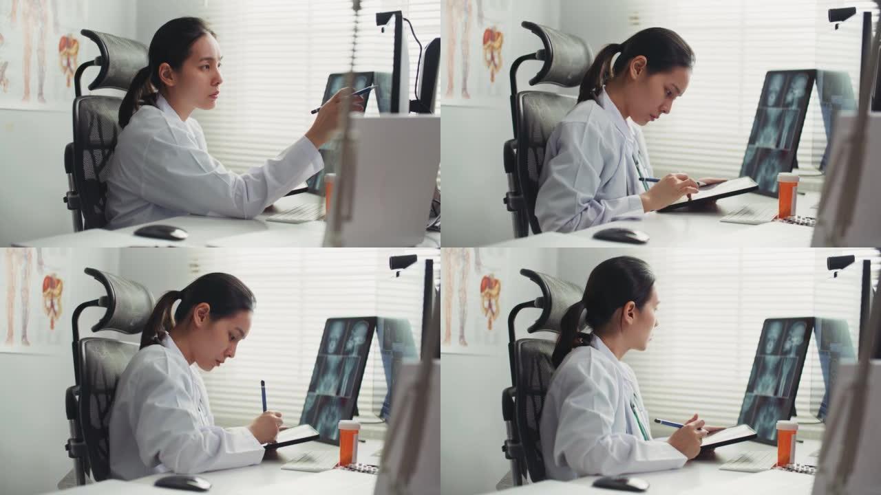 女医生在医院工作空间使用数字平板电脑的多莉