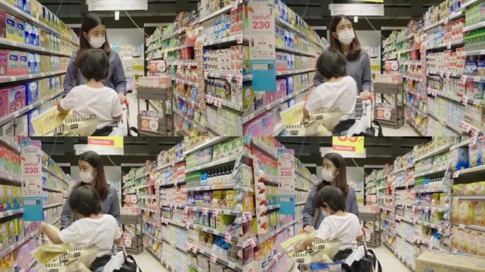Mother and son doing weekly shop in grocery store