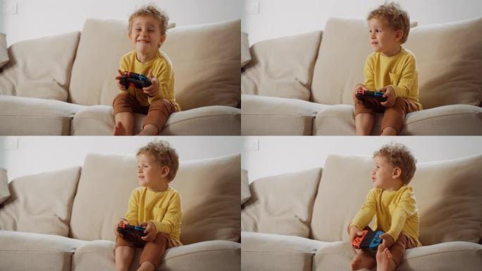 一个可爱的男性蹒跚学步的肖像，拿着遥控器或视频游戏机，想玩。微笑着享受娱乐技术的小男孩