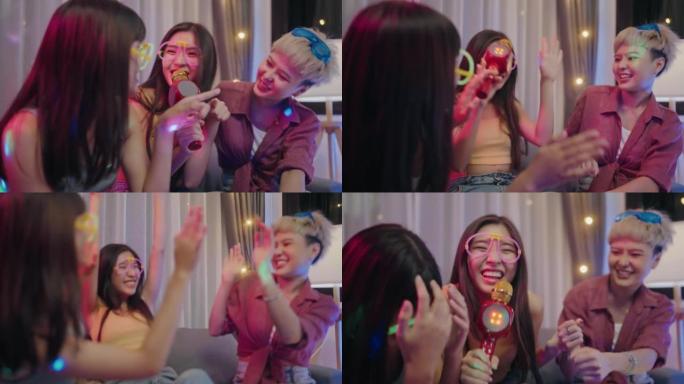 快乐的女性朋友在家里玩得开心卡拉ok派对