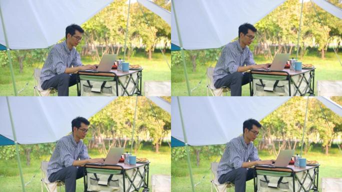 露营时在户外工作的商人