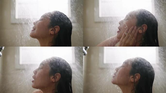 亚洲妇女正在浴室洗头和沐浴露
