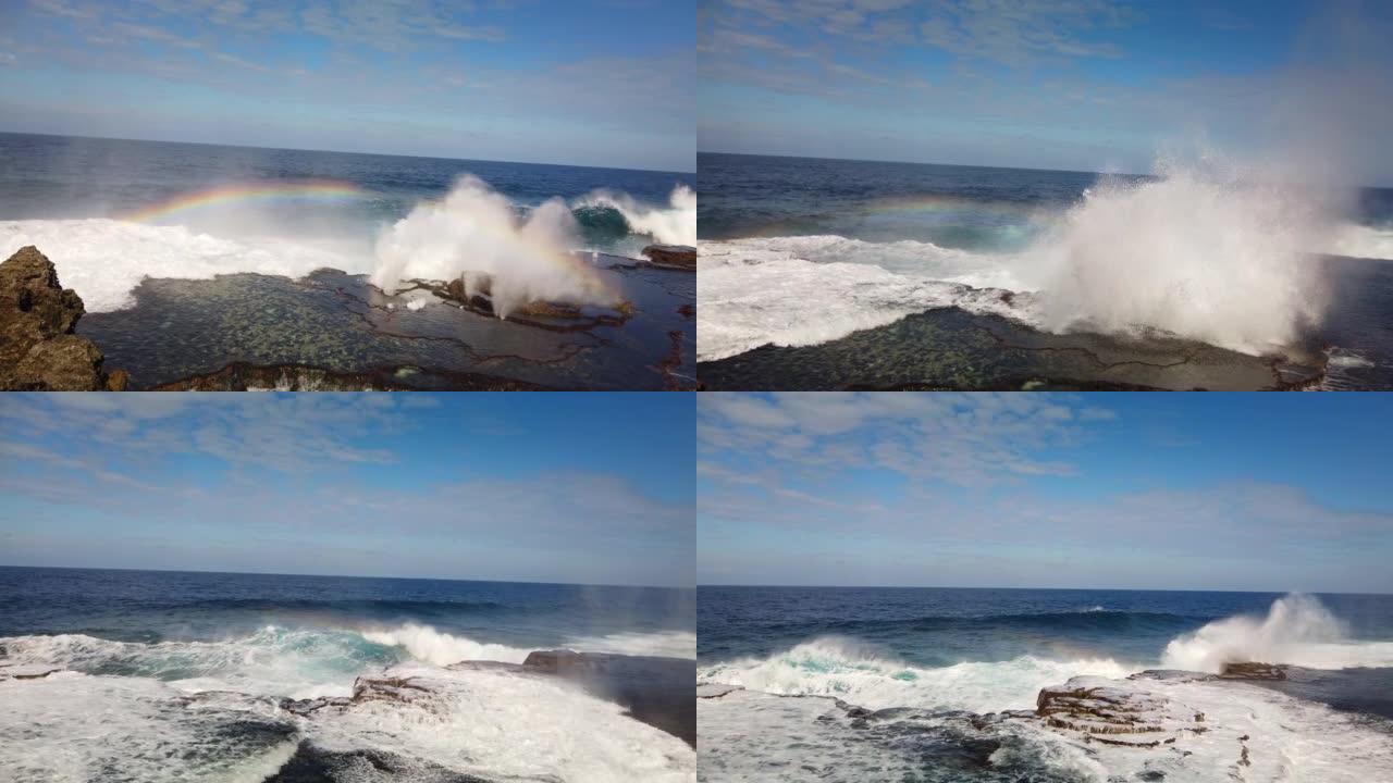 海浪的空中特写镜头在暴风雨来临前坠入荒岛的岩石悬崖。
