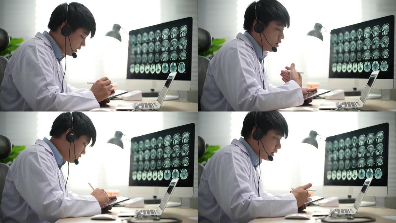 医生戴耳机建议在笔记本电脑上进行远程医疗，远程办公