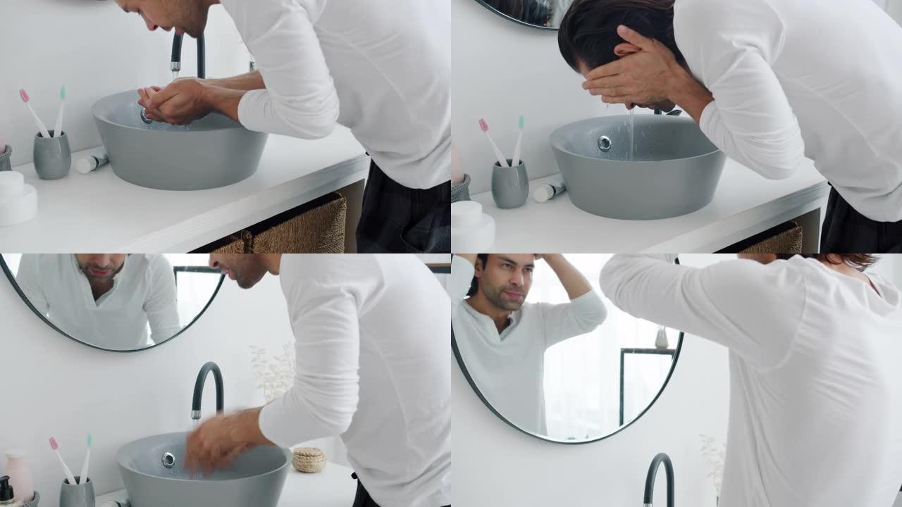 好看的黑发洗手和洗脸，然后抚摸头发看着浴室里的镜子
