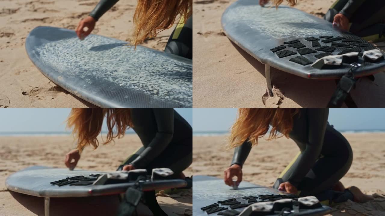 一个女人用粉笔在冲浪板上画线