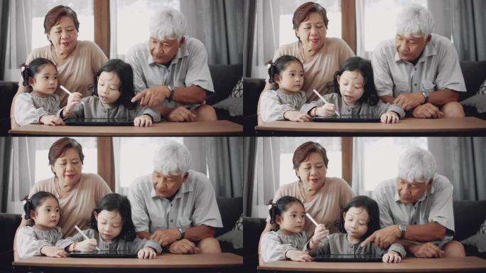 亚洲男孩和祖父母在家参加在线课程。