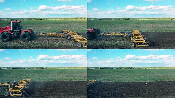 一台机器在田地上行驶，将其耕种。