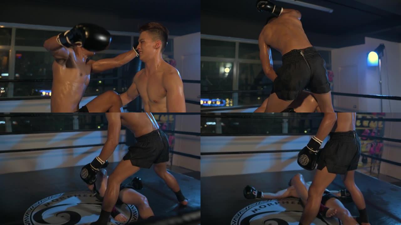 泰拳拳手身体攀爬在拳击场比赛中向下跳肘击击倒对手