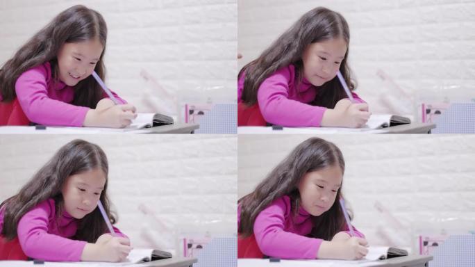 小女孩在做作业小女孩写作业特写视频素材