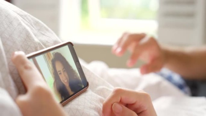 一对无法识别的夫妇使用智能手机进行视频通话的4k视频片段
