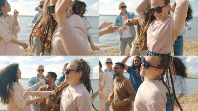 快乐的女学生和朋友在海滩户外派对上跳舞很开心